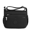 Lightweight nylon crossbody bag in Black – water-resistant, 4 zip sections and wide adjustable strap