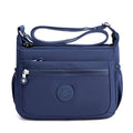 Lightweight nylon crossbody bag in Navy – water-resistant, 4 zip sections and wide adjustable strap
