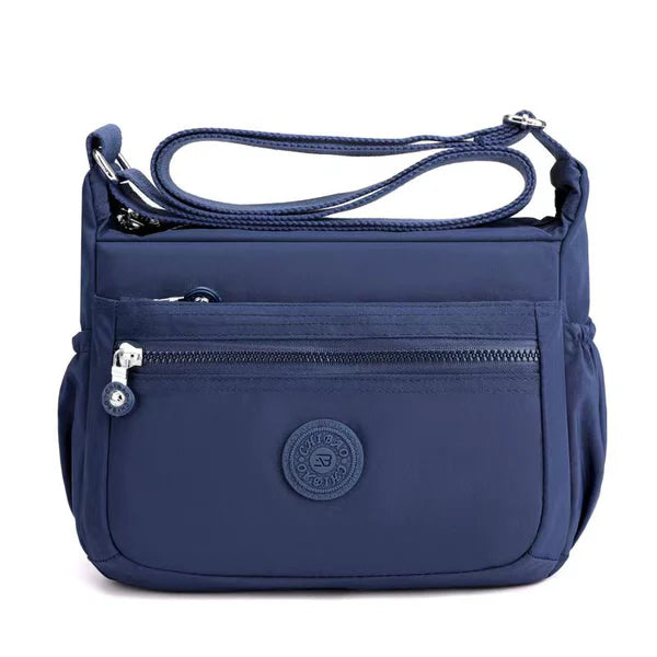 Lightweight nylon crossbody bag in Navy – water-resistant, 4 zip sections and wide adjustable strap