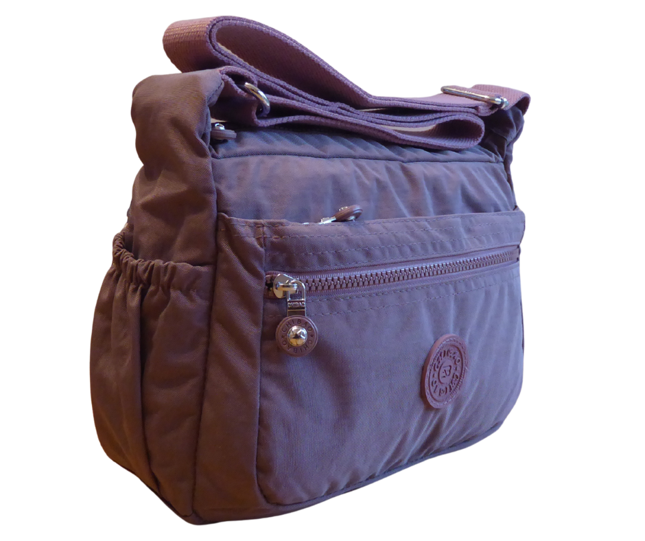 Lightweight nylon crossbody bag front view – showing 3 front zip sections and 38mm adjustable strap