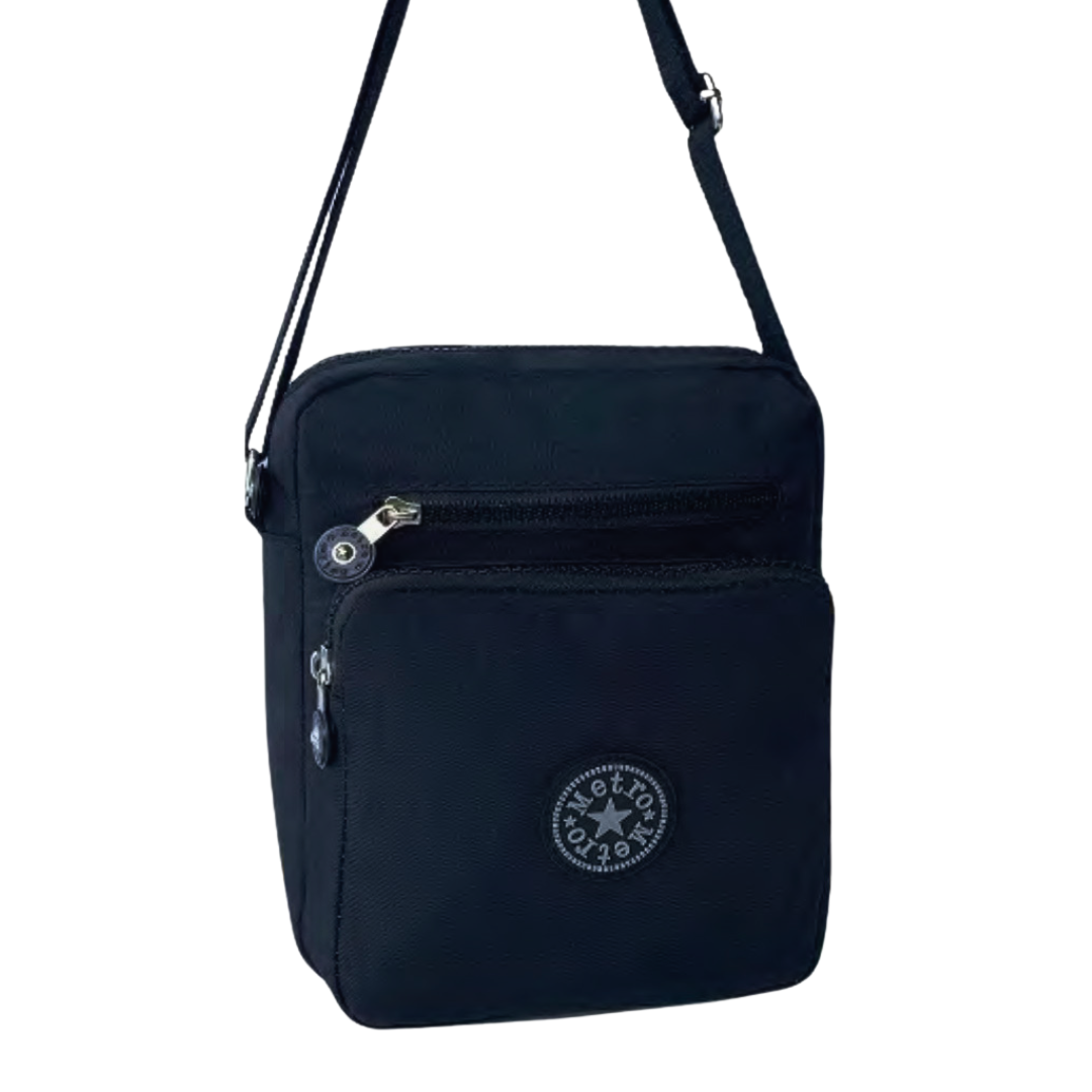A black crossbody bag with a front zippered pocket and  a circular logo patch, shown against a plain white background.