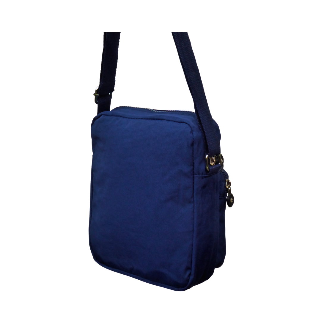 A navy blue rear view fabric crossbody bag with a matching shoulder strap, and a zippered top closure, shown against a plain white background.