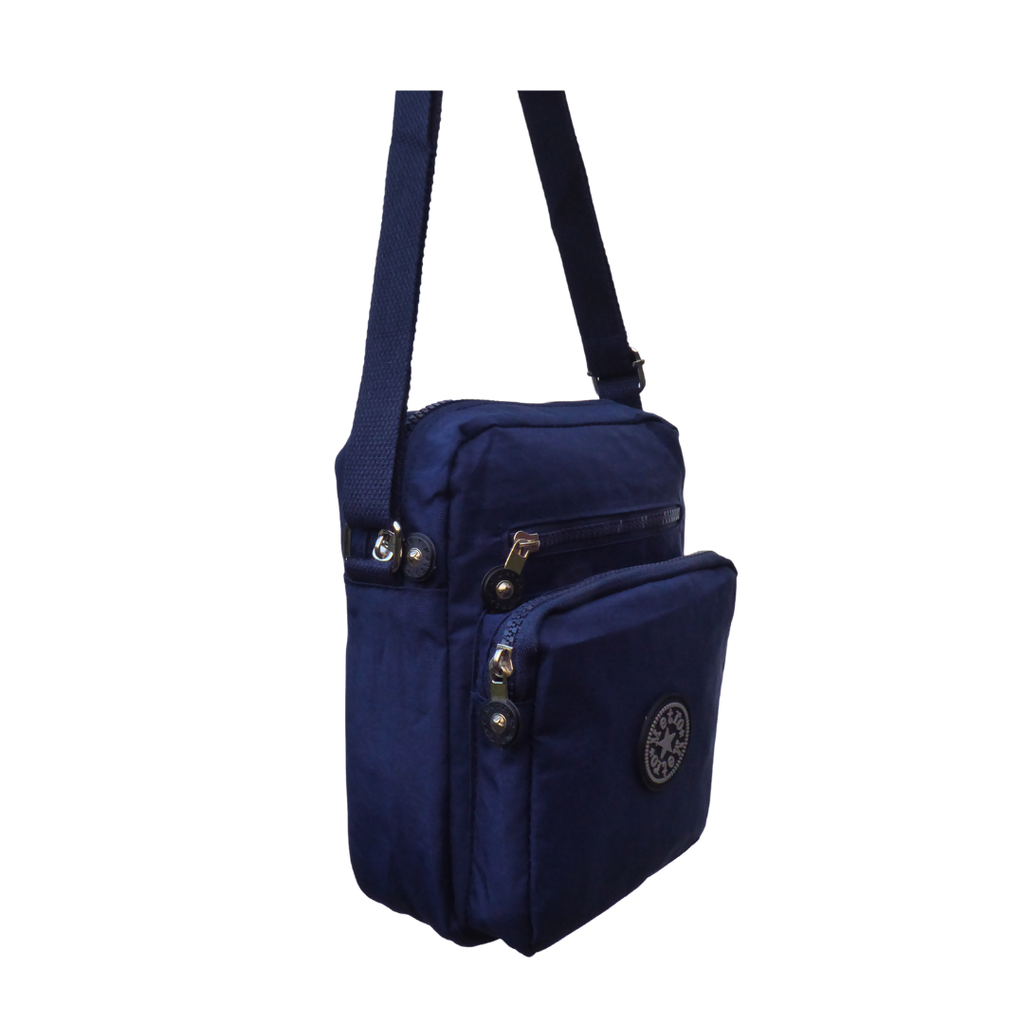 A navy blue nylon crossbody bag with multiple zippered pockets and a circular  logo emblem on the front pocket, shown against a plain white background.