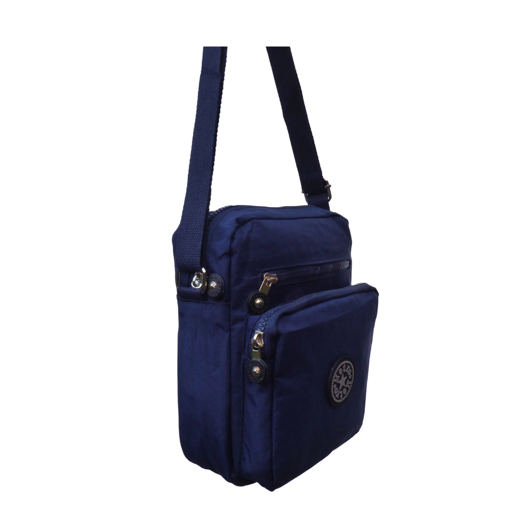 A navy blue nylon crossbody bag with multiple zippered pockets and a circular  logo emblem on the front pocket, shown against a plain white background.