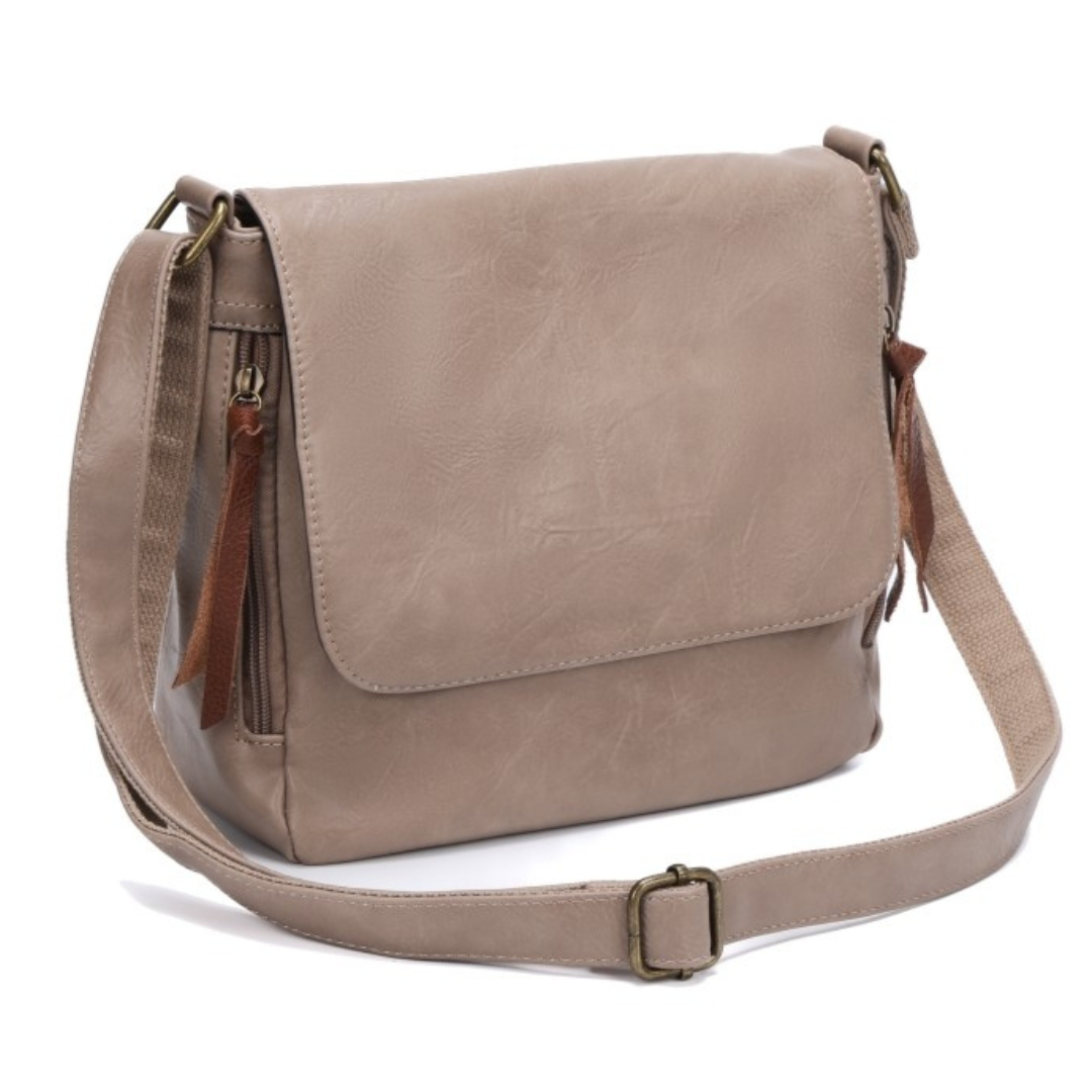 Front view of leather-look vegan crossbody bag with twin side zip pockets, magnetic front flap and brass hardware