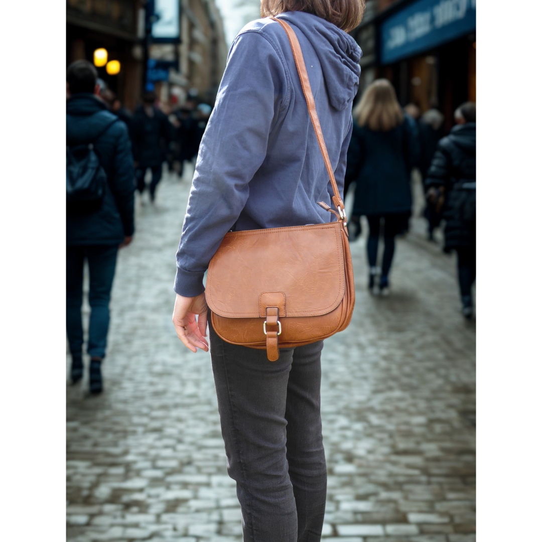 Saddle crossbody shoulder bag — lifestyle angled view