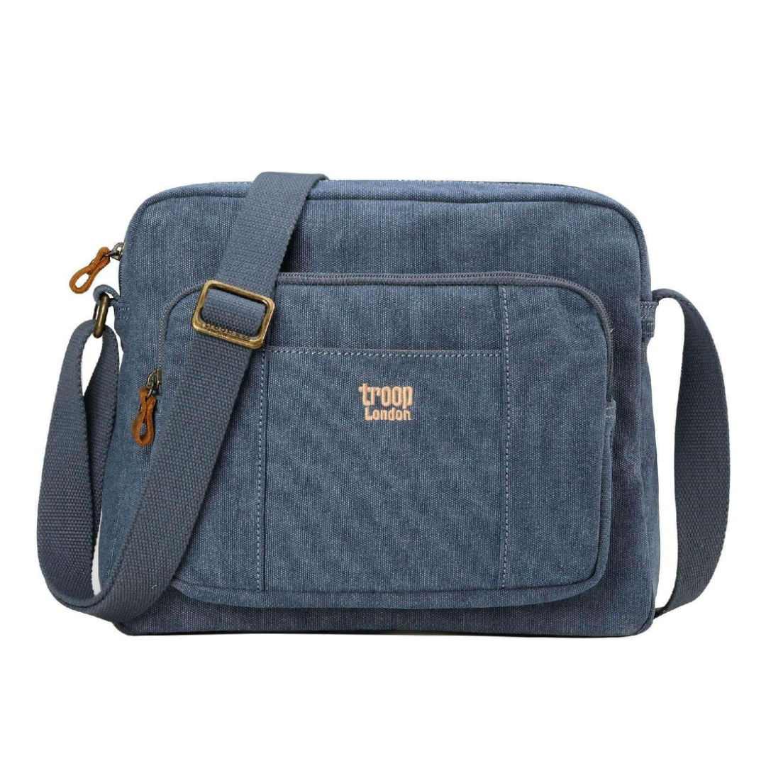 Blue Troop London Large Canvas Cross-body Bag - A4 Size & Brass Hardware with an adjustable shoulder strap, and a small tan 'troop London' logo on the front pocket, shown against a plain white background.