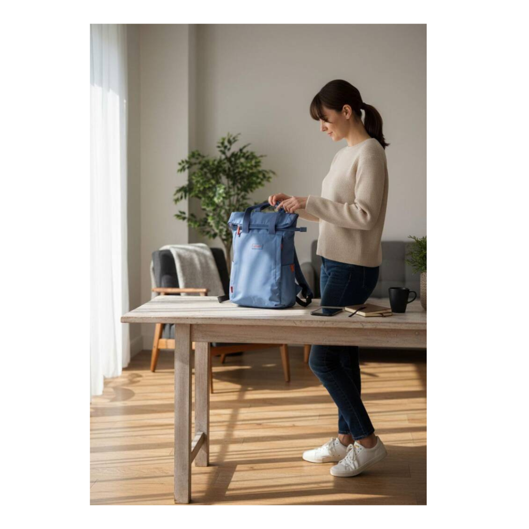 Spirit Eco Roll Top Backpack - Lightweight & Water Resistant - lifestyle photo with the bag on a table